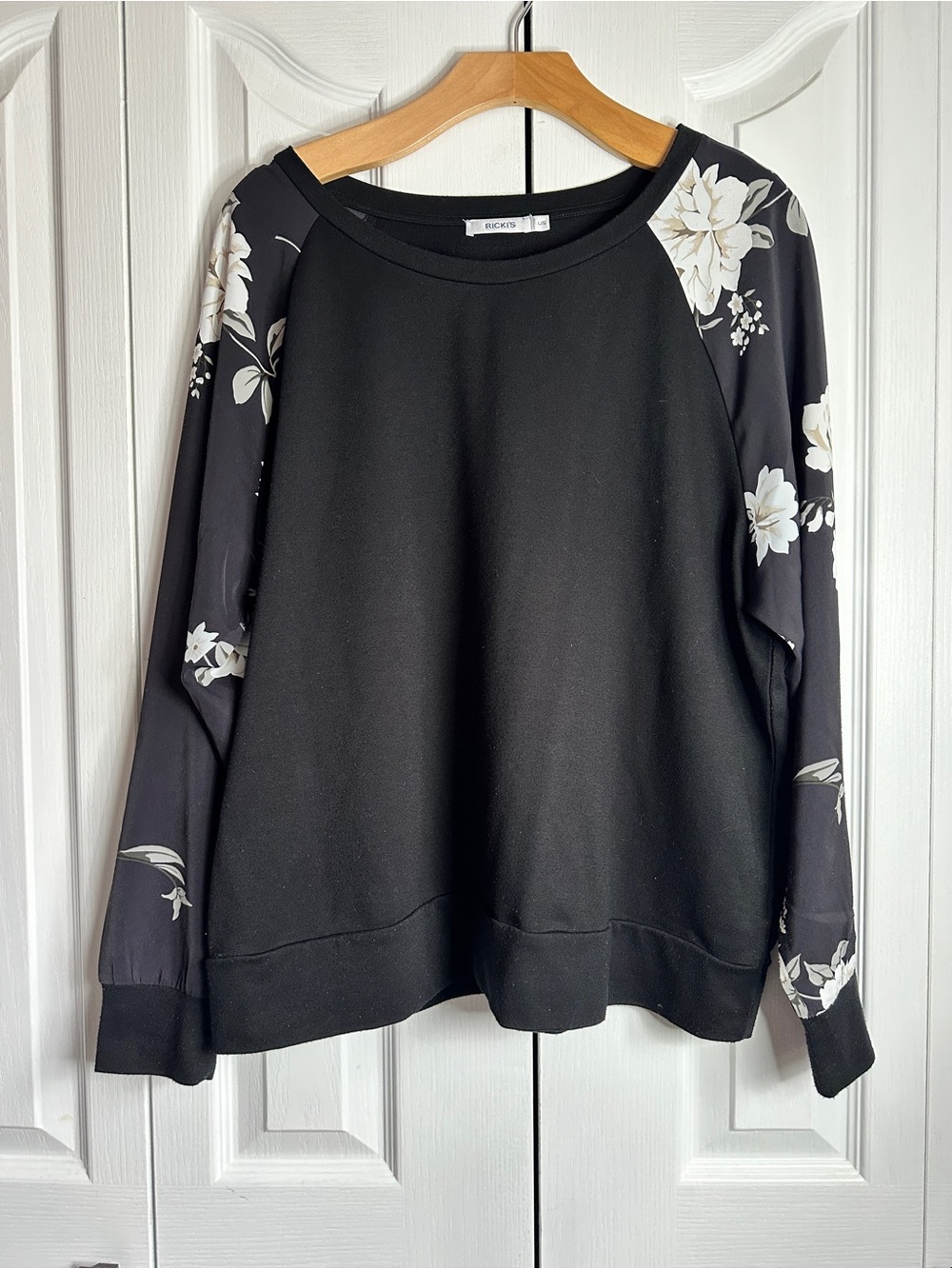 Ricki's Black Top with White Floral Raglan Sleeves